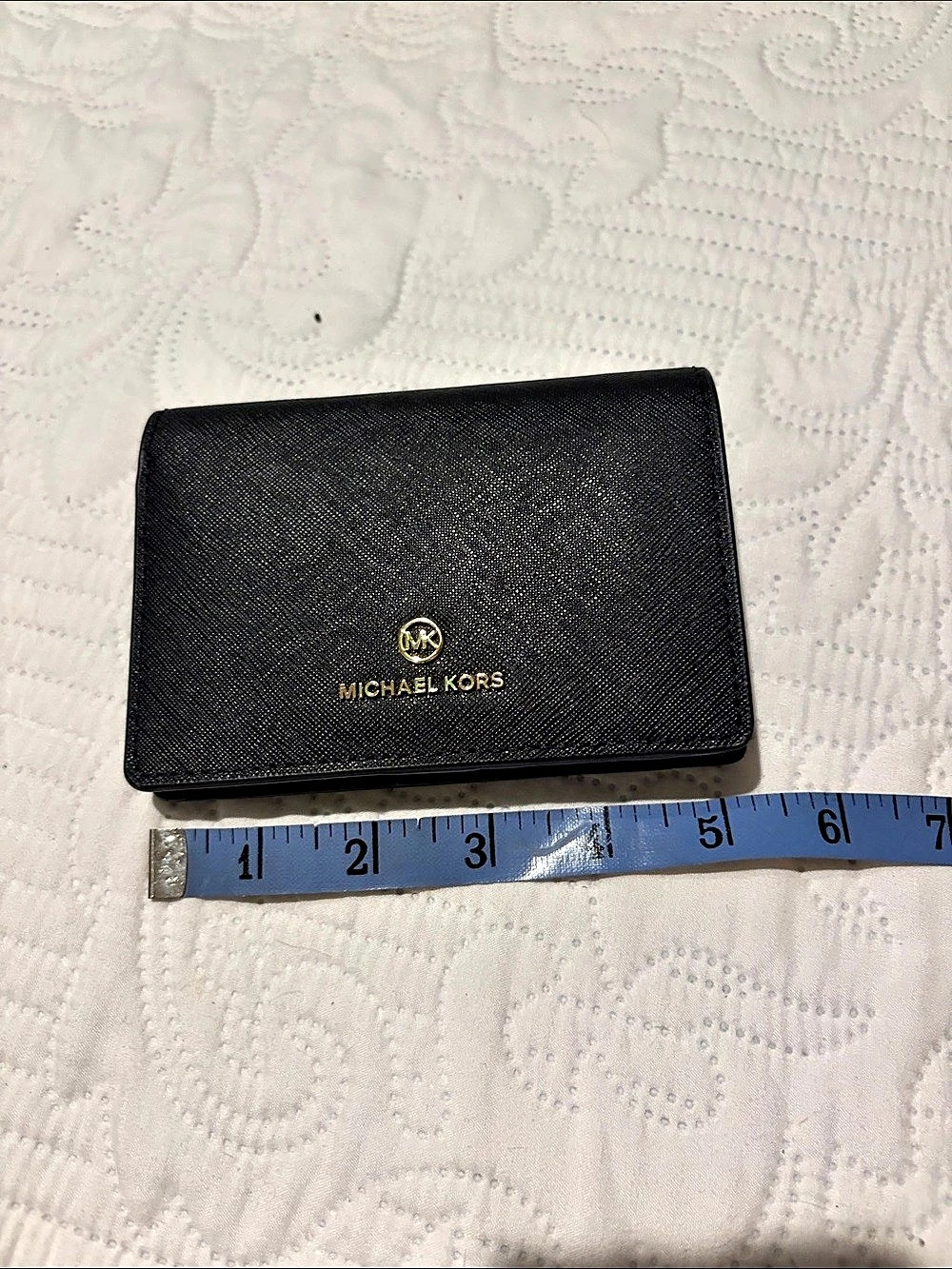 Michael Kors Jet Set Travel Saffiano Leather wallet.